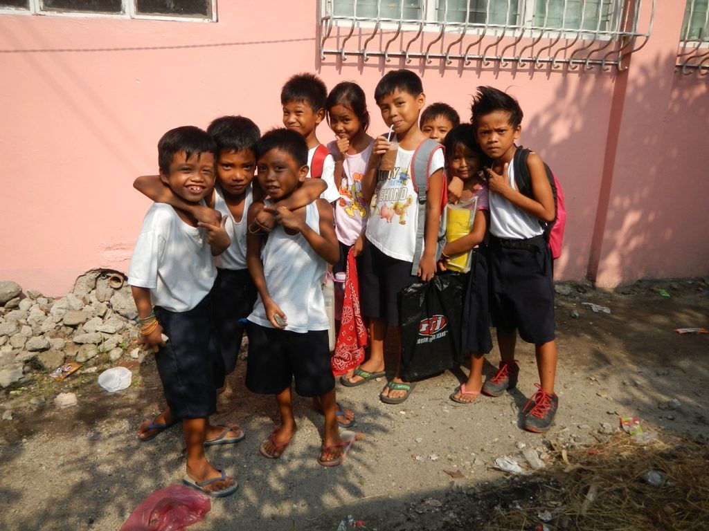 Children of a Philippine neighbourhood standing together